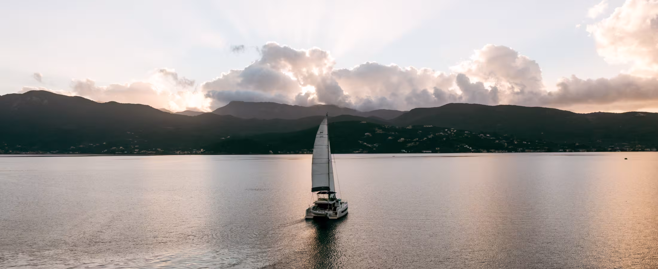 Yacht traveling on green Ionian Sea