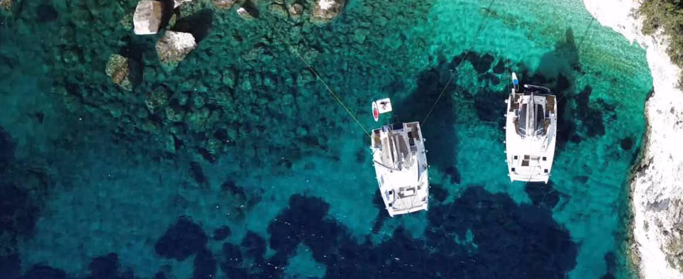 Yacht on green Ionian Sea